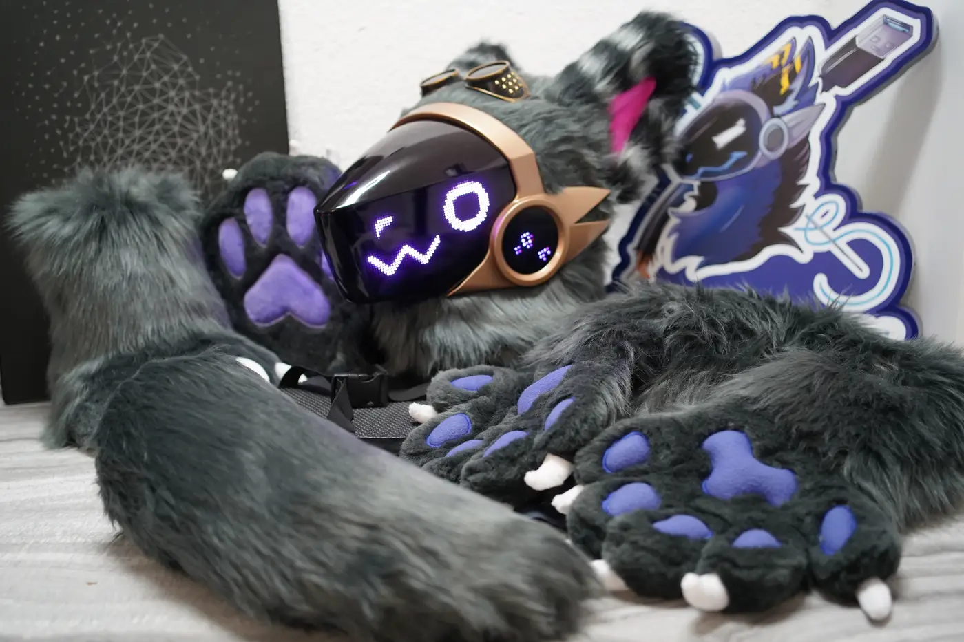 Grey Protogen head, hand paws, feet paws and striped tail with the Arget and Lazuli logo