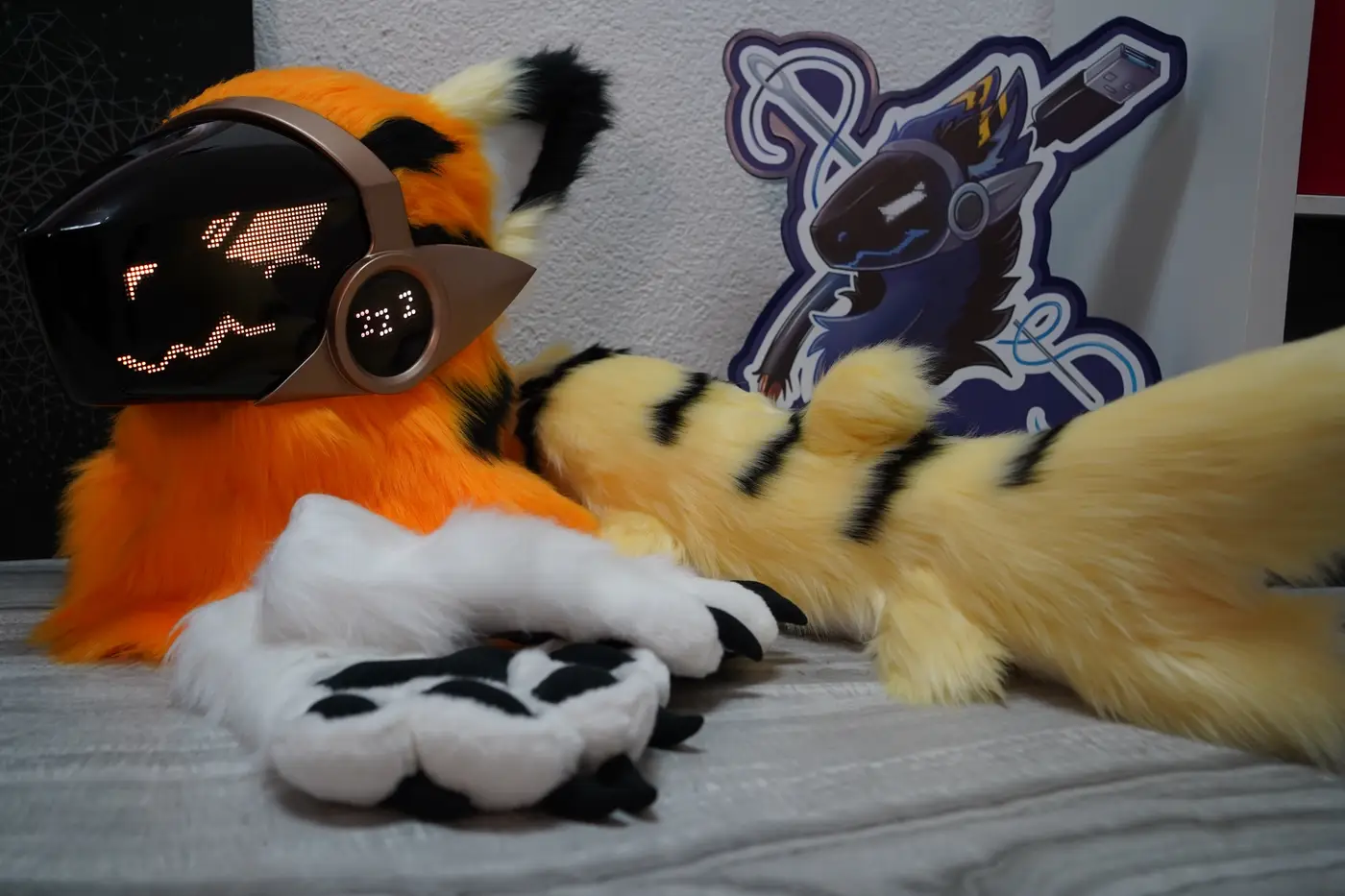 Orange Protogen head, white hand paws and striped cream tail with the Arget and Lazuli logo