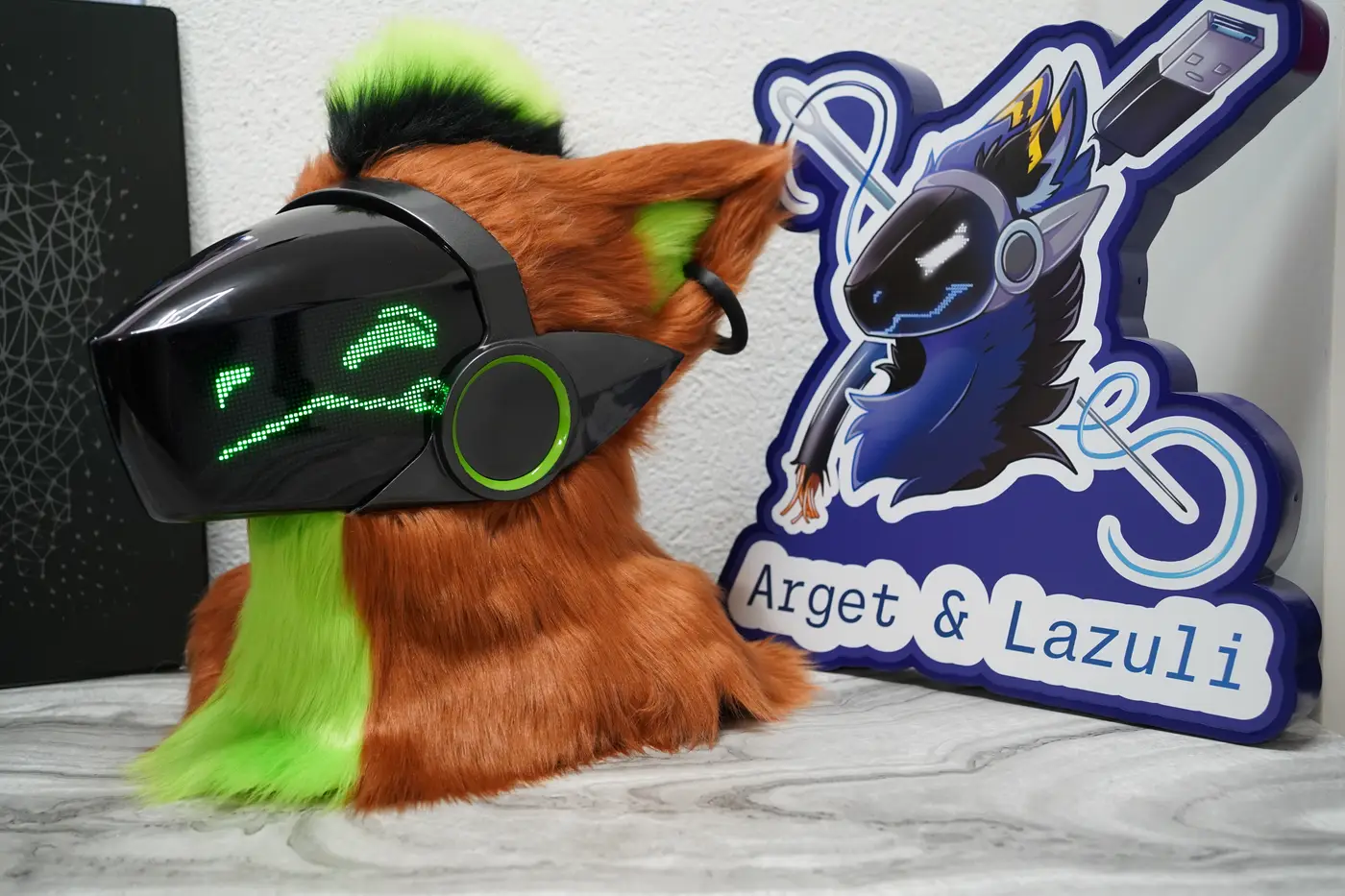 Rust brown Protogen head with narrowed green pixel eyes and a wavy mouth on the black LED visor