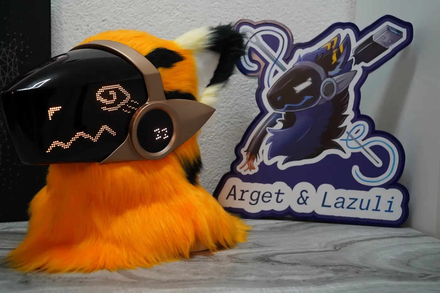 Orange Protogen head with a curled orange mouth and a closed eye on the LED visor