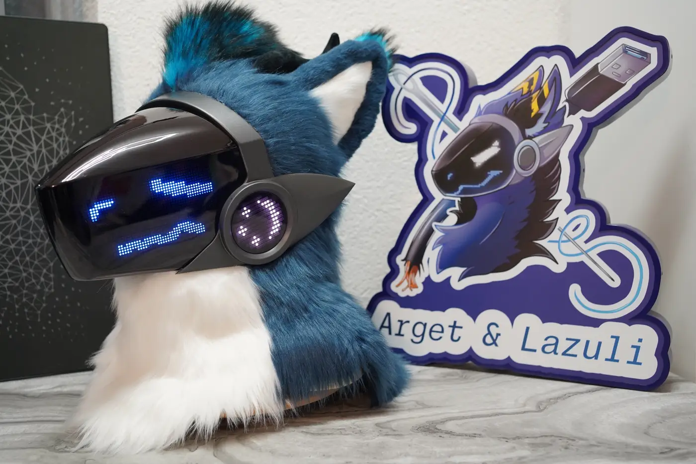 Teal and white Protogen head with a wide blue grin on the black LED visor