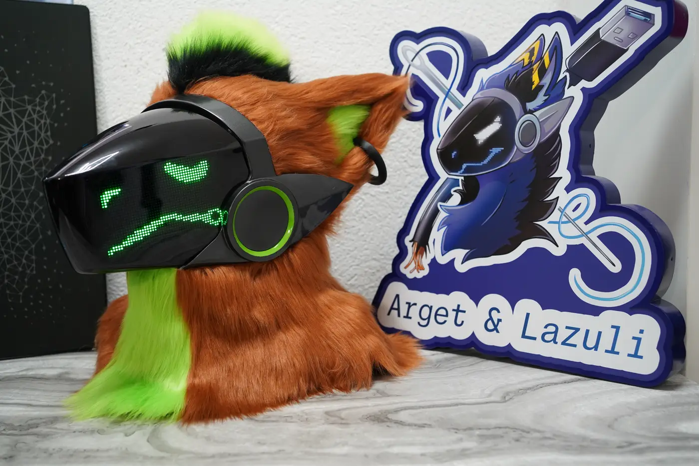 Rust brown Protogen head with arched green pixel eyes and a long wavy mouth on the black LED visor