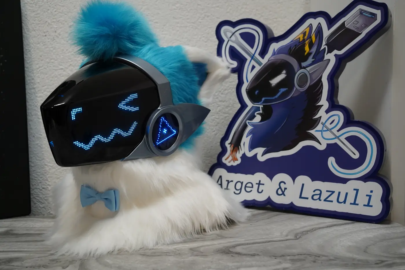 White Protogen head with narrowed blue pixel eyes and a long zigzag mouth on the LED visor