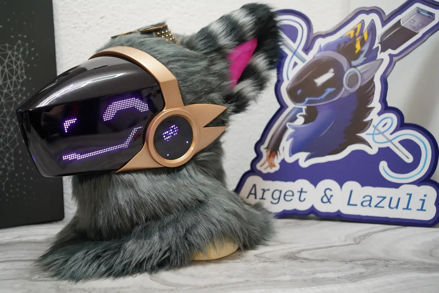Grey Protogen head with a long purple squiggle across the LED visor
