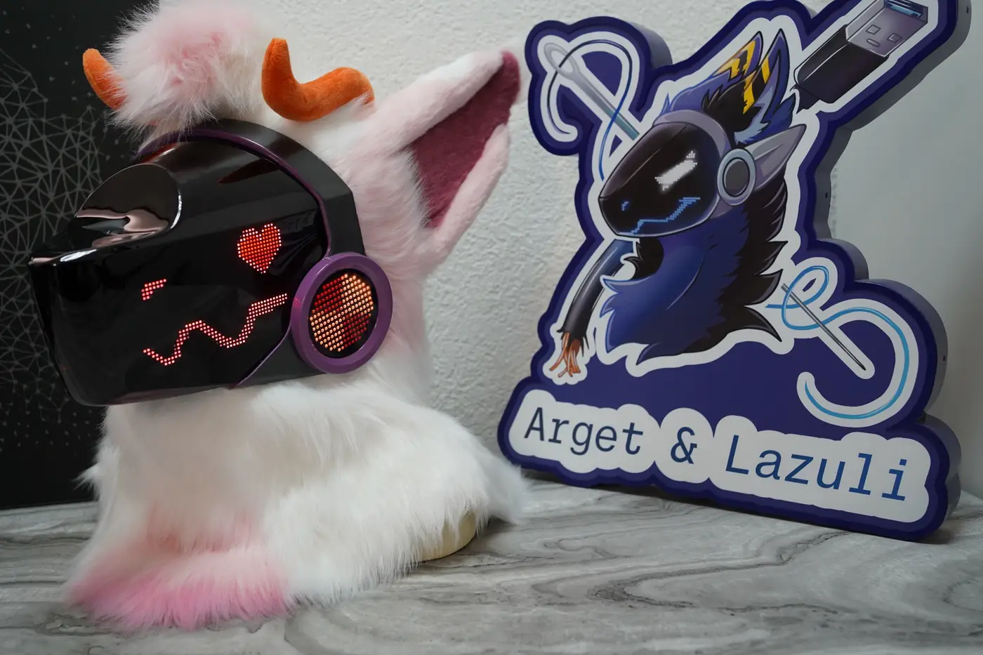 White and pink Protogen head with a red heart on the purple rimmed cheek disc