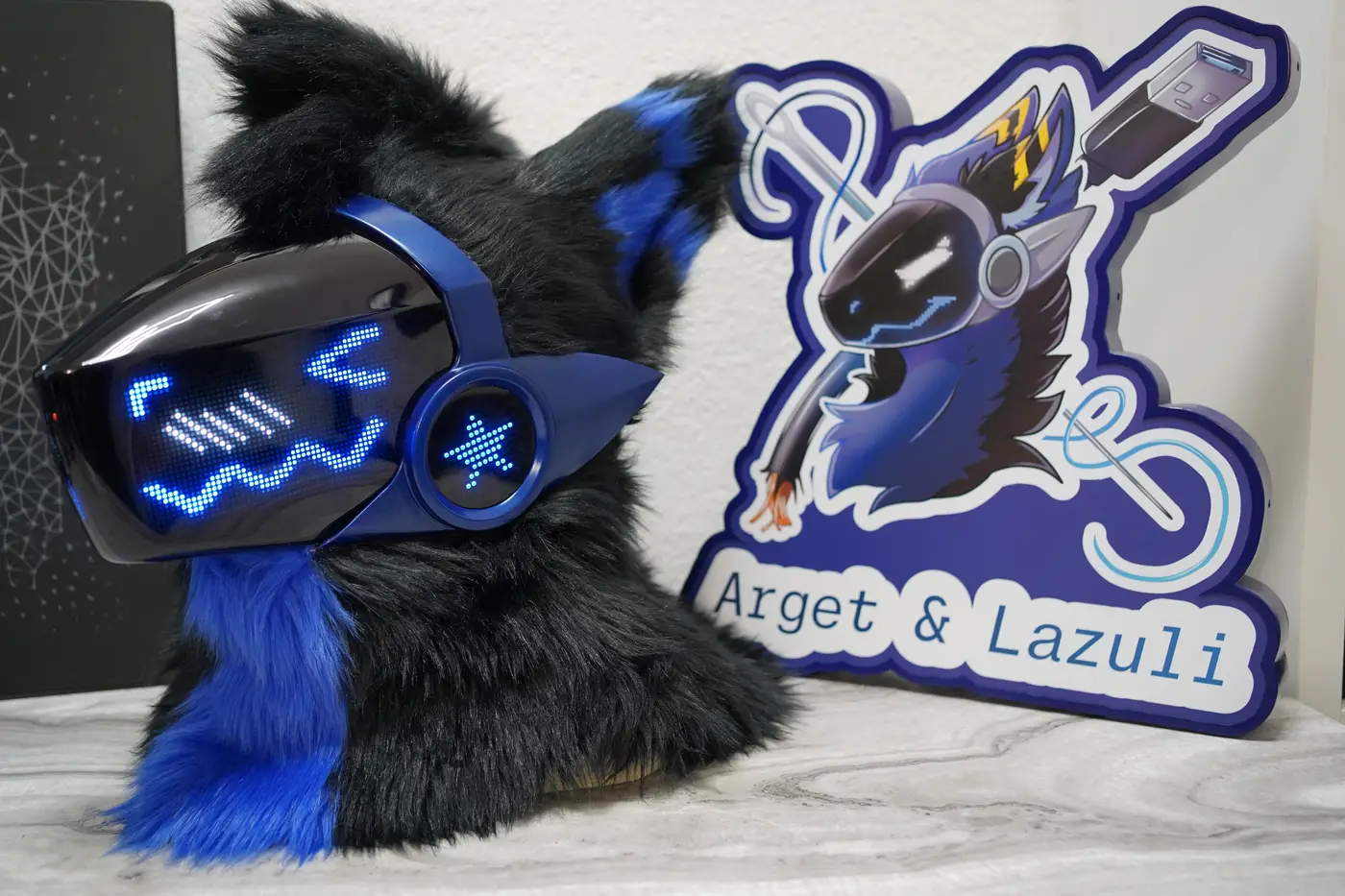 Black Protogen head with wavy blue lines across the LED visor