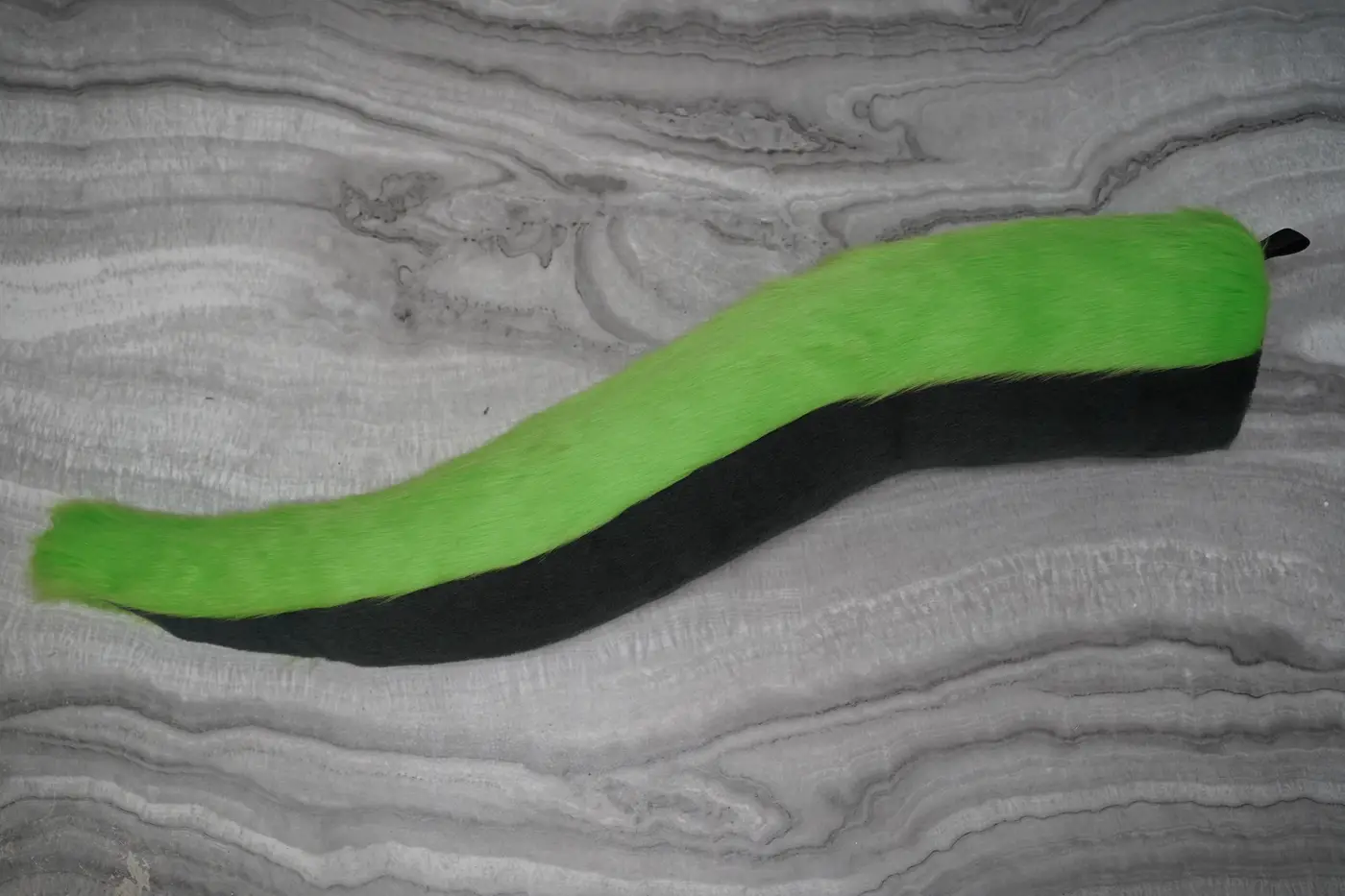 Lime green dragon shaped tail with a black underside, hand sewn for the Protogen partial