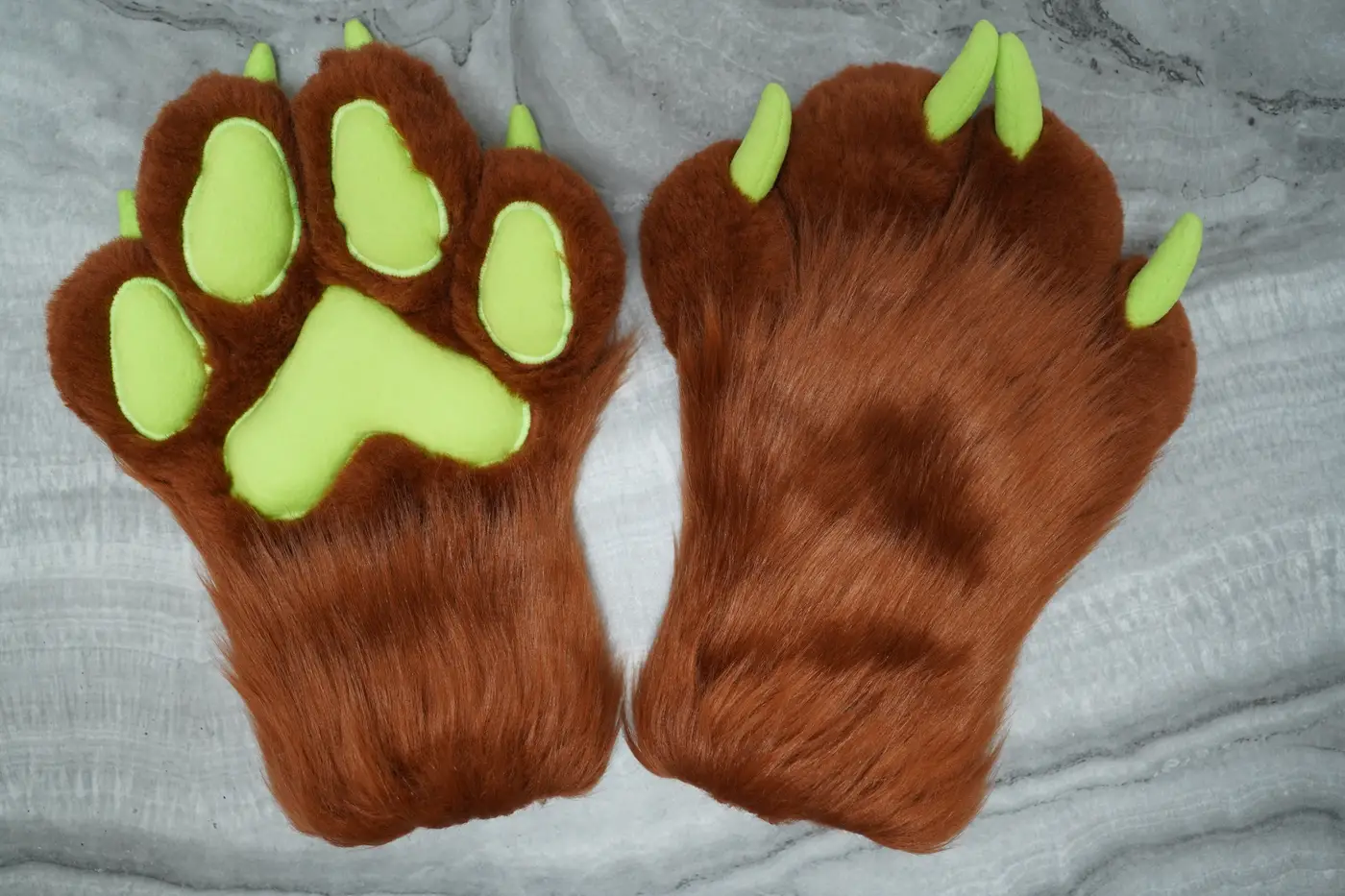Rust brown four finger puffy Protogen hand paws with lime green paw pads and green claws