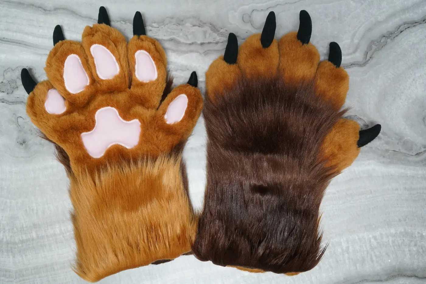 Tan and brown five finger Protogen hand paws with pink paw pads and black claws
