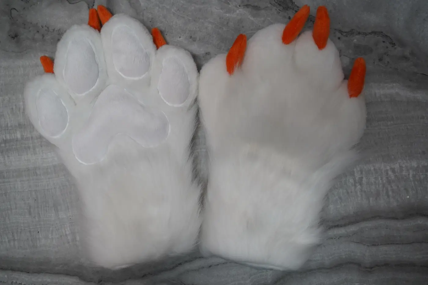 Large white Protogen hand paws with orange claws