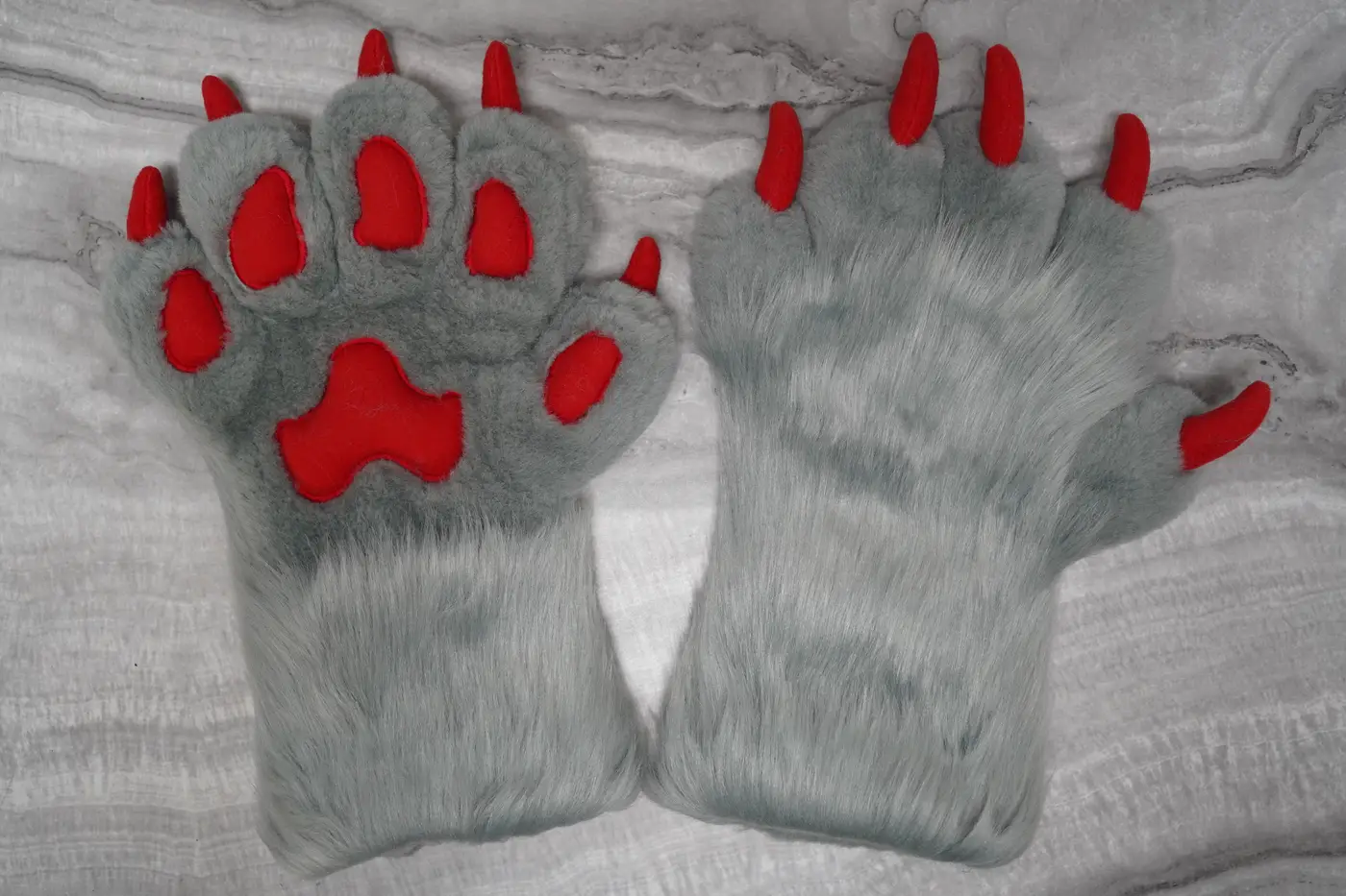 Gray five finger puffy Protogen hand paws with red paw pads and red claws
