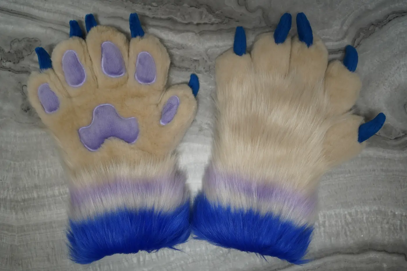 Cream five finger puffy Protogen hand paws with lavender paw pads, blue claws and blue cuffs