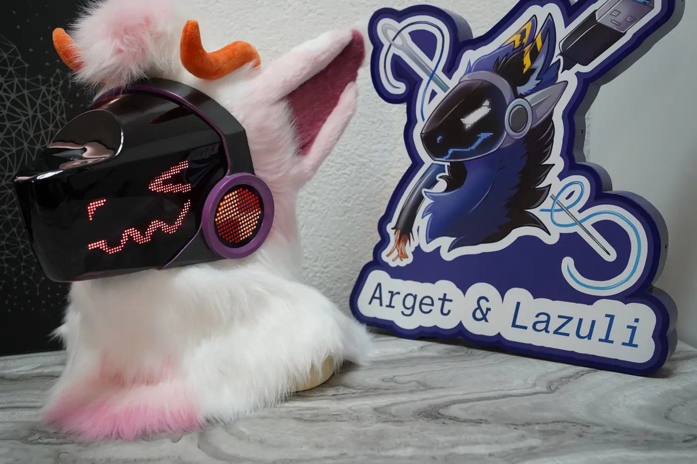 White and pink Protogen head with a wide open red mouth on the LED visor