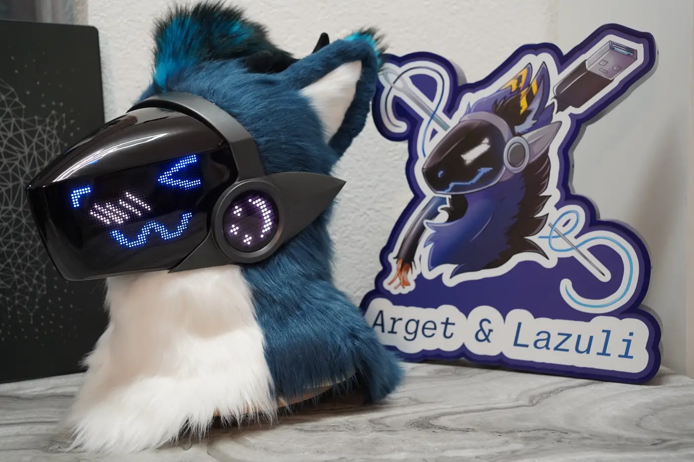 Teal Protogen head with a blue X over one eye on the LED visor