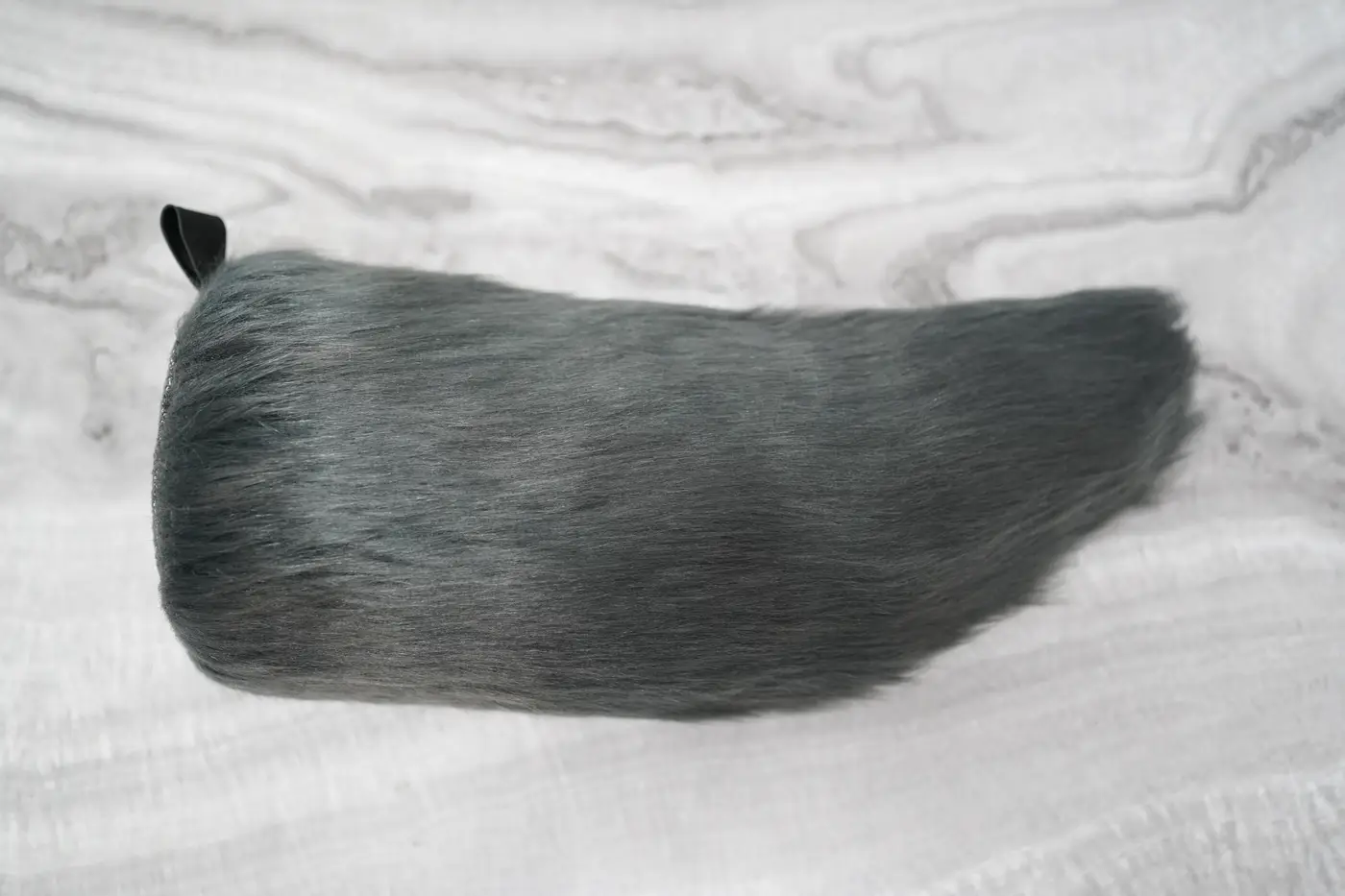 Long grey Protogen tail with silver tipped fur and a darker end