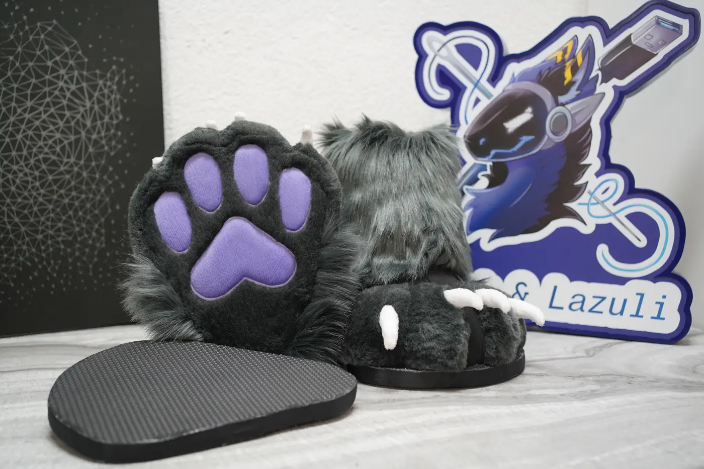 Grey Protogen feet paw with purple pads beside its black nonslip sole