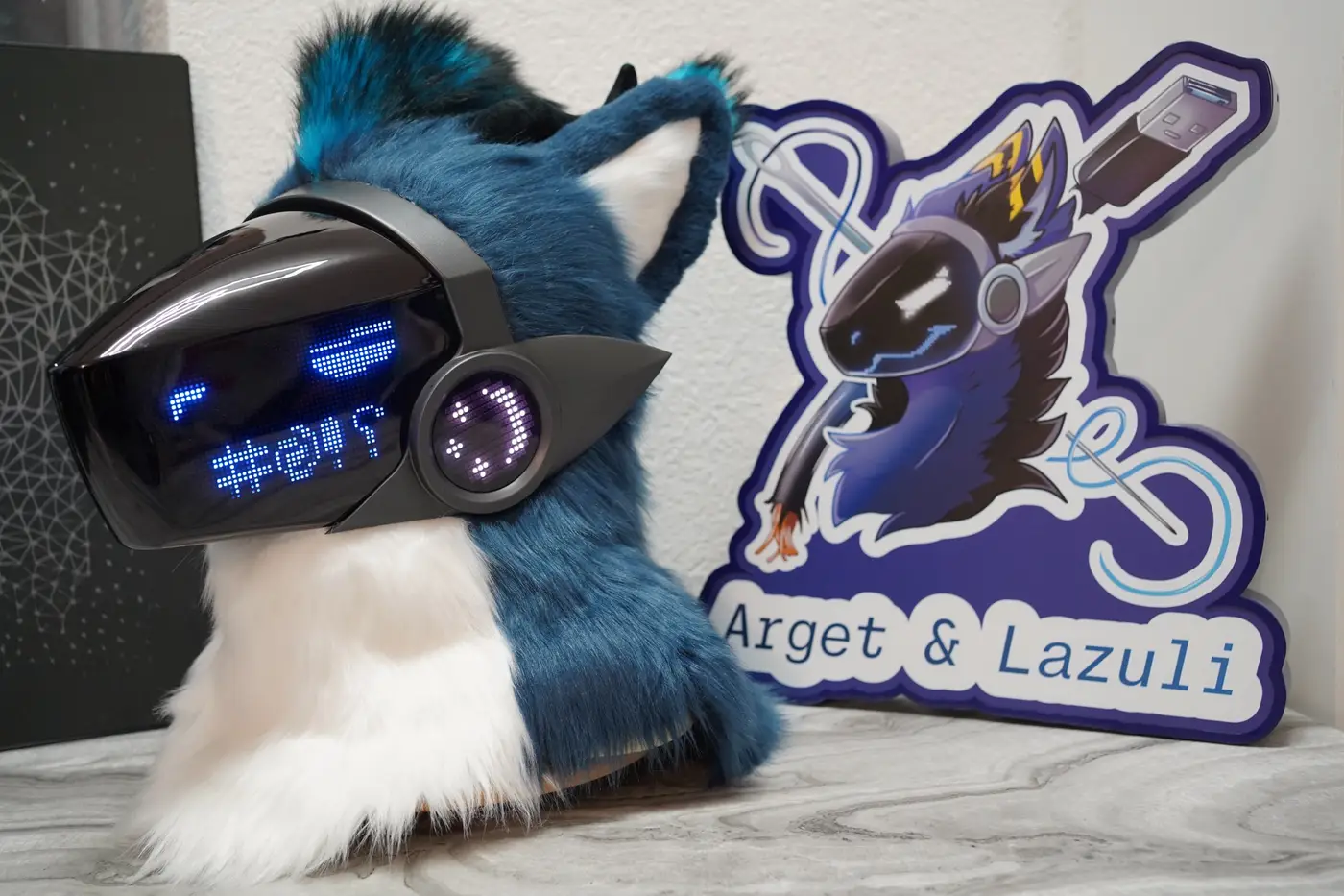 Teal Protogen head with blue symbols across the LED visor