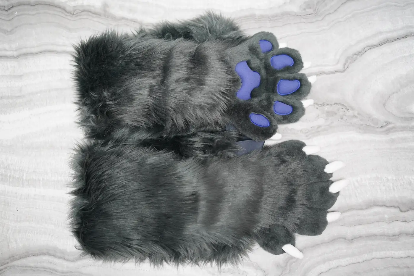 Pair of grey Protogen feet paws with purple pads and white claws