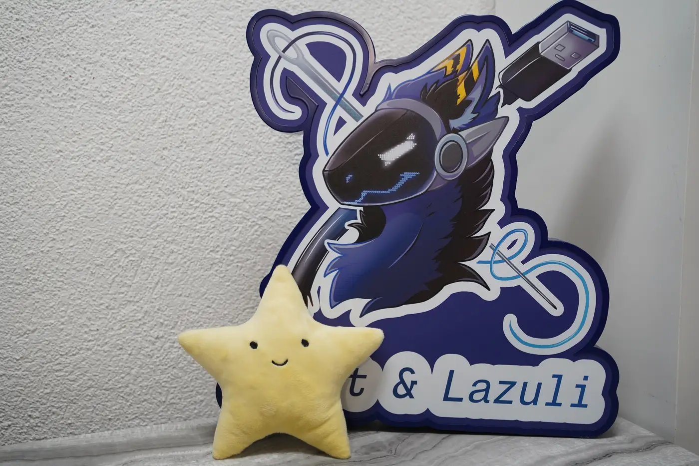 Handmade smiling yellow star plush from the light blue Protogen partial commission