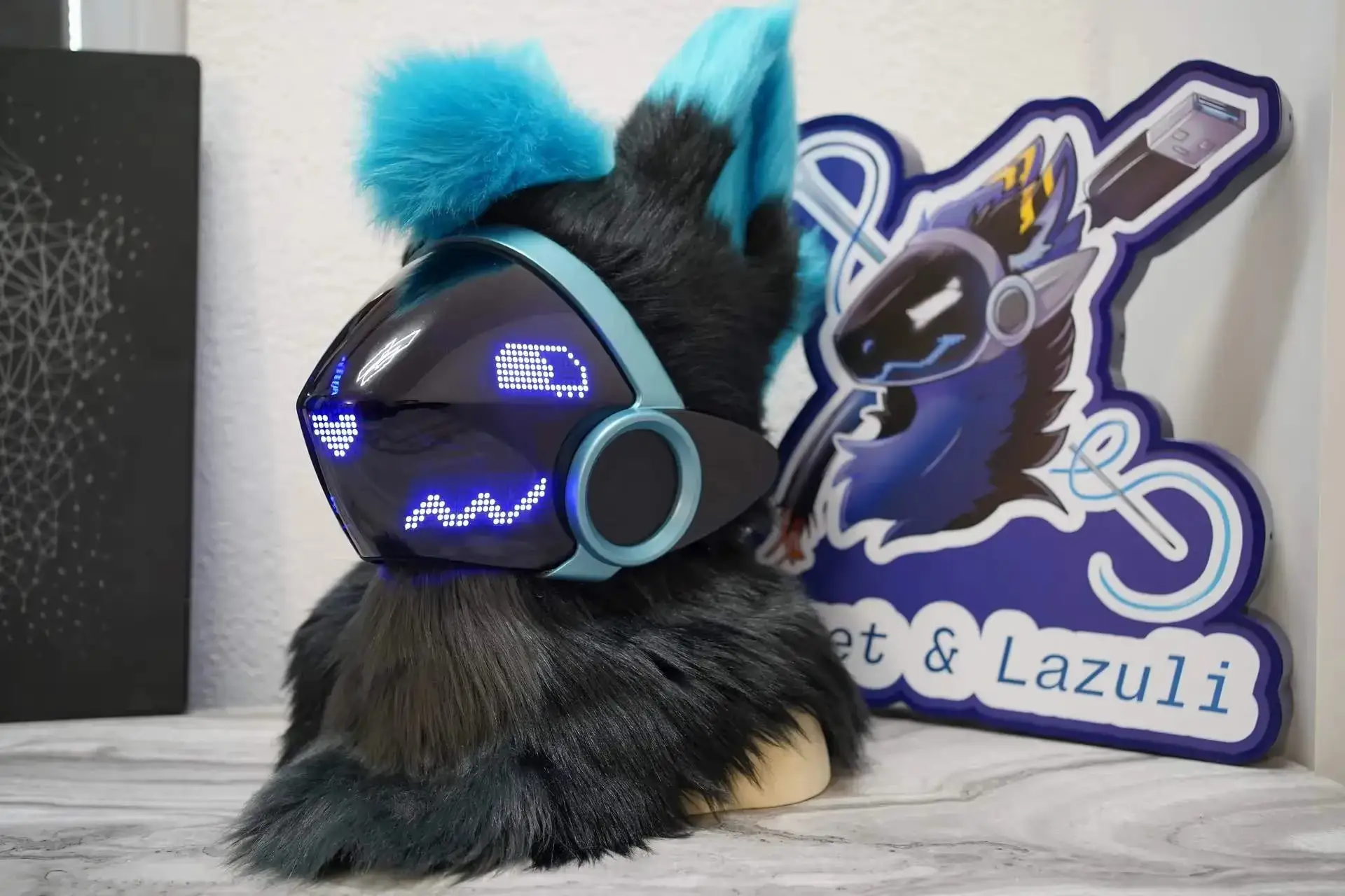 Gray and teal Protogen head on a stand with a black visor, blue pixel eyes and a teal mane, by Arget & Lazuli