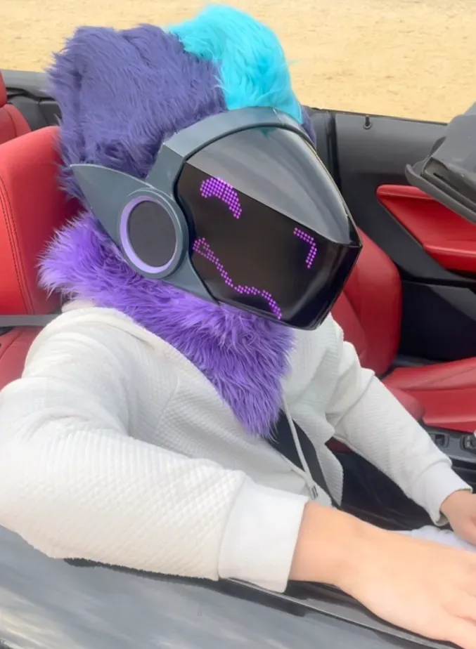 Purple and teal Protogen with a dark magenta pixel visor, in a red interior convertible, by Arget & Lazuli