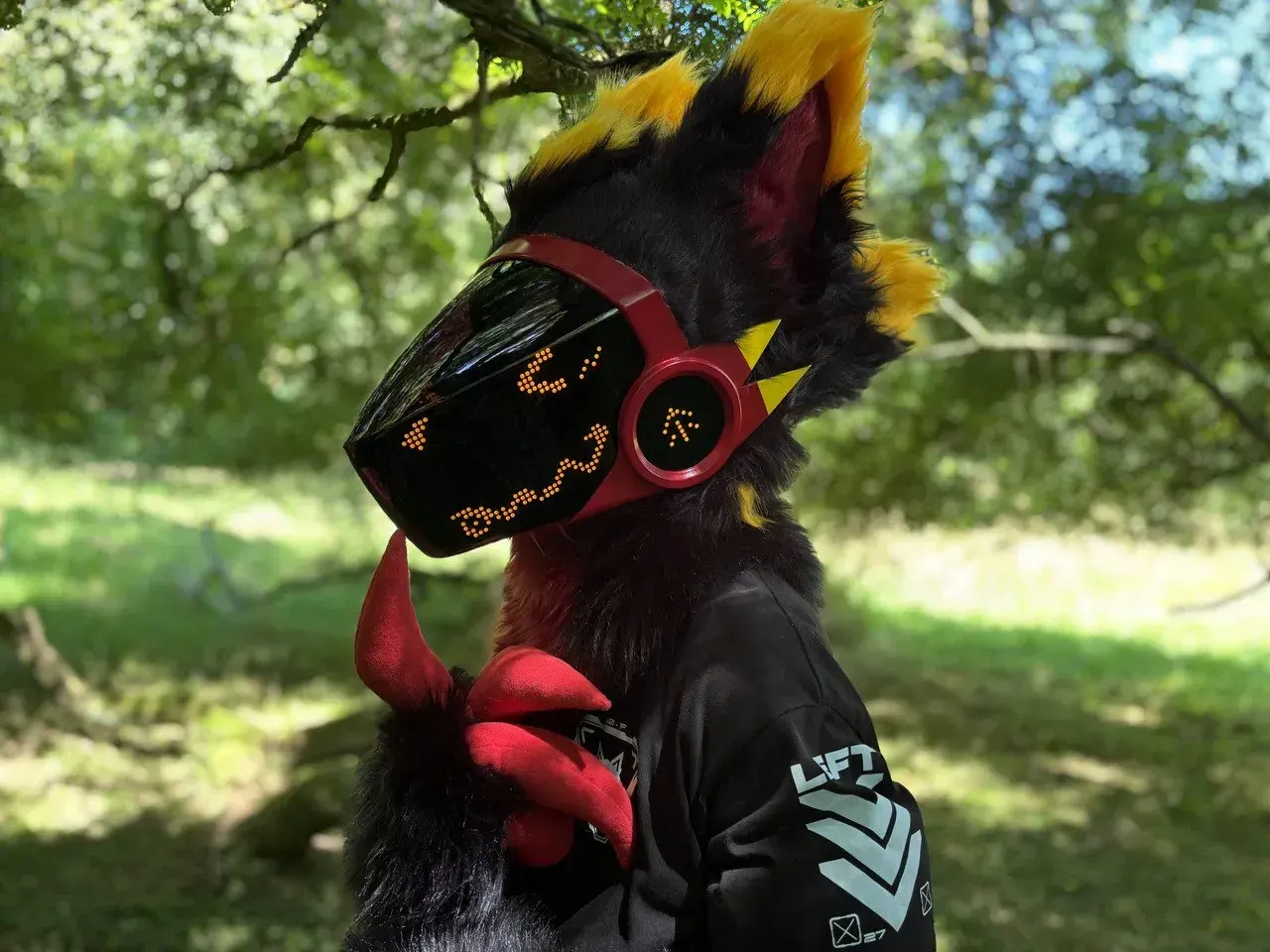Black Protogen partial with a yellow mane and red visor showing amber pixel eyes, in sunny woods, by Arget & Lazuli