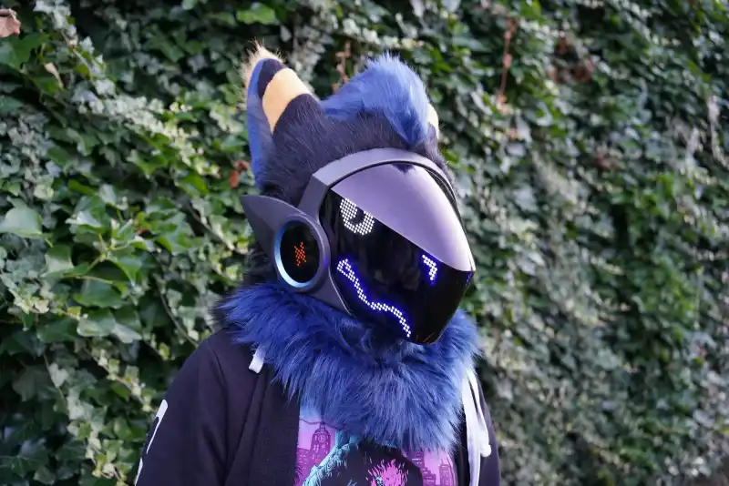 Hornet, a blue Protogen fursuit head with a purple and blue LED visor, handmade by Arget & Lazuli